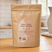 Bare Blends Raw Cacao Fava Protein 500g pouch on a kitchen bench